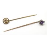 Two stick pins, one set with amethyst and diamonds. Approx 2 1/4" long (2) Please Note - we do not