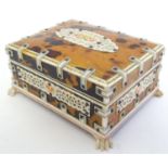 A 20thC cedar wood table top cigarette box with faux tortoiseshell and bone decoration. Approx. 2" x