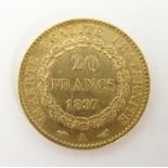 A French Republic 20 franc gold coin, 1897, approx. 6.45g Please Note - we do not make reference