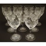 Nine wine glasses, with star banding. 6" tall (9) Please Note - we do not make reference to the