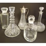 An assortment of crystal and glass including decanters, claret jug etc (5), the largest 11" tall