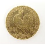 A French Republic 20 franc gold coin, 1909, approx. 6.45g Please Note - we do not make reference