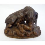 A late 19th / early 20thC carved wooden dog with puppies in the black forest style. Approx. 4"