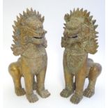 A pair of 19thC / 20thC gilt metal Thai singha temple lions / foo dogs. Approx. 10 1/2" high (2)