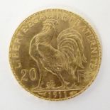 A French Republic 20 franc gold coin, 1911, approx. 6.45g Please Note - we do not make reference