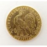 A French Republic 20 franc gold coin, 1911, approx. 6.45g Please Note - we do not make reference