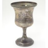 A silver trophy cup of goblet form hallmarked Birmingham 1942 maker Davies & Power. Approx 7"