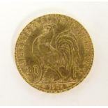A French Republic 20 franc gold coin, 1904, approx. 6.45g Please Note - we do not make reference