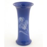 A Royal Worcester Sabrina porcelain spill vase of cylindrical form with a flared foot and rim,