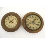 Two early-20thC circular wall clocks for restoration, each of oak and pine construction with steel