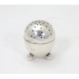 A Victorian silver pepperette of egg form on three ball feet. 1 1/2" high Please Note - we do not