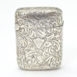 A Victorian silver vesta case with engraved acanthus scroll decoration, hallmarked Birmingham