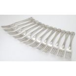 A Victorian set of twelve Old English Thread pattern table forks with engraved armorial to