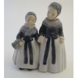A Royal Copenhagen figure of two Amager girls in traditional dress, model no. 1316, designed by