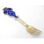 A Danish sterling silver gilt and enamel 1974 Christmas fork with The Bluebird design. Maker A.