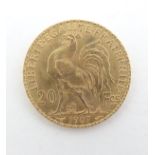 A French Republic 20 franc gold coin, 1907, approximately 6.5g Please Note - we do not make