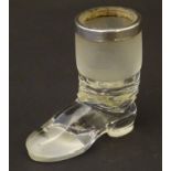 Glass: an early 20thC novelty glass novelty Vesta formed as a boot, with hallmarked silver rim