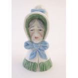 A Royal Worcester figural candle snuffer modelled as an old woman. Marked within. Approx. 3 1/2"