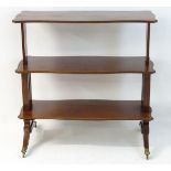 A 19thC mahogany metamorphic table/ whatnot with three shaped reeded and decoratively strung tiers