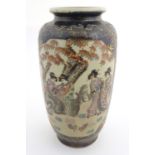 A Japanese vase with panelled decoration depicting figures in a landscape with chickens. Approx.