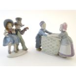 A Carl Scheidig German figural group depicting a boy and girl on an oval base, marked under.