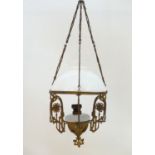 Lighting: a French Art Nouveau pendant oil lamp, with milk glass shade and reservoir, supported by a