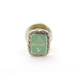 Vintage Adverting: A silver enamelled lapel pin / badge with green enamel decoration marked