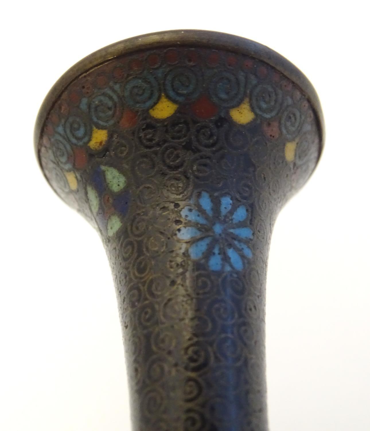 A pair of early 20thC cloisonne bottle vases with elongated necks and flared rims, with floral - Image 7 of 9