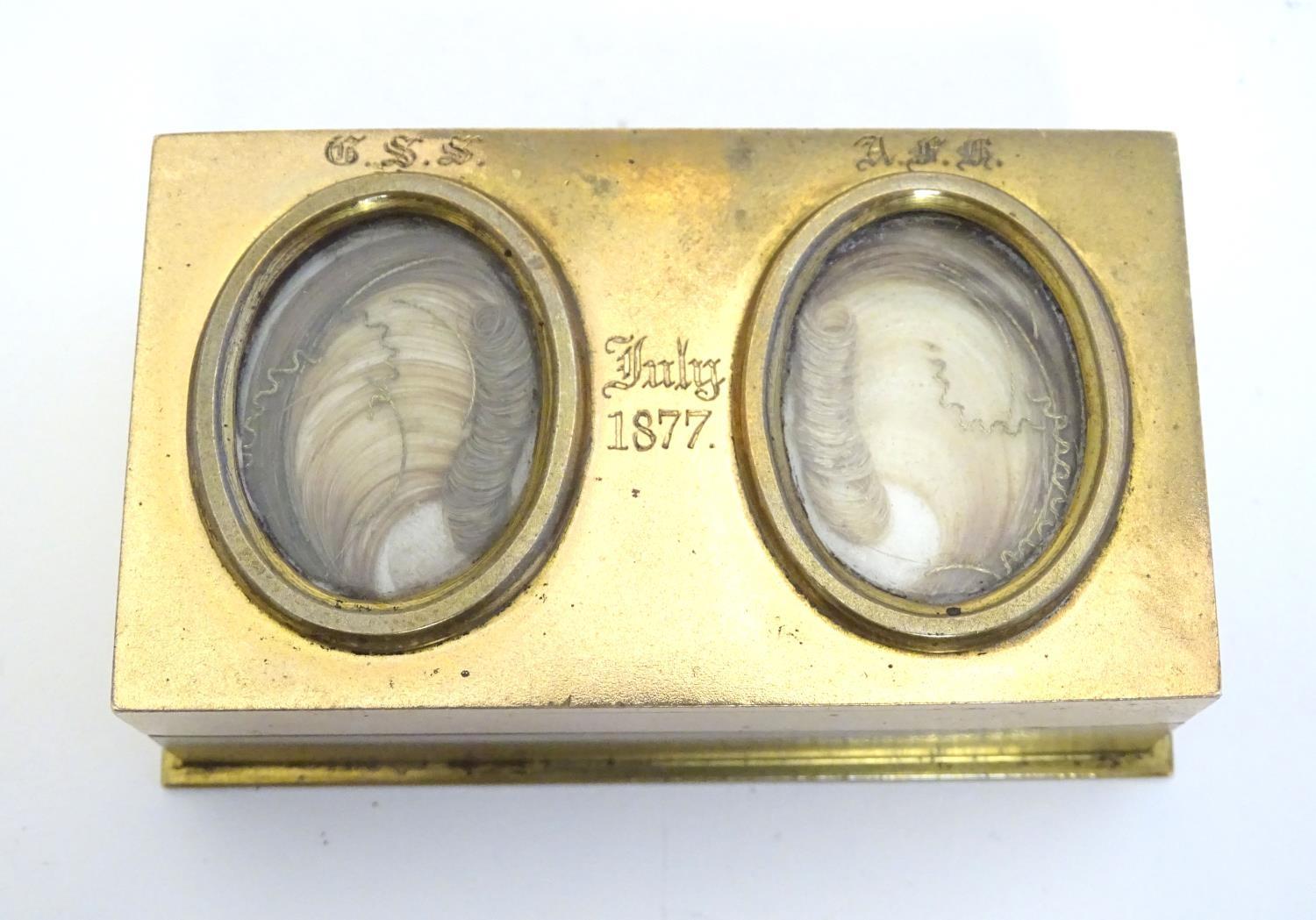 An unusual Victorian gilt metal box set with twin oval locket sections to lid containing locks of - Image 10 of 15