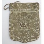 A Turkish drawstring bag / pouch decorated with a scrolling foliage design in gold thread with the