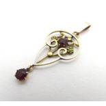 A 9ct gold Art Nouveau pendant set with amethyst stones 1 1/2" long Please Note - we do not make
