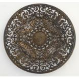 A cast Coalbrookdale charger with pierced Neoclassical style decoration with mythical hippocampi,