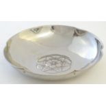 A Keswick School of Industrial Art (KSIA) Firth Staybrite bowl with a lobed rim, hammered decoration