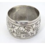 A silver napkin ring with engraved decoration, hallmarked Chester 1903 Please Note - we do not