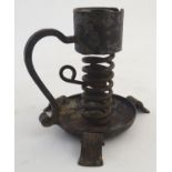 A late 19thC Continental wrought iron spiral candlestick, marked under Josef Schmirler, Wien /