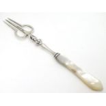 An unusual silver pickle fork with mother of pearl handle, hallmarked Birmingham 1901, maker
