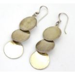 A pair of .925 silver and white metal pendant earrings with three circular discs. Approx. 2" long