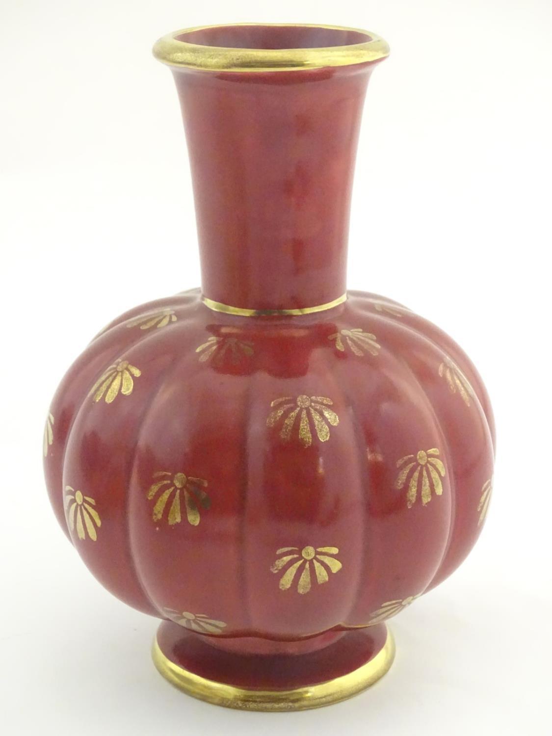 A Swedish single handled vase with a ribbed bulbous body and an elongated neck, with gilt stylised - Image 5 of 7