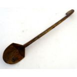 Ethnographic / Native / Tribal: A carved wooden tribal spoon of elongated form. Approx. 22" Please
