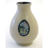 A Moorcroft trial vase in the shape 7/5, decorated with a fish and thistle design. Impressed mark