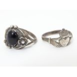 A silver ring set with onyx cabochon together with a silver Claddagh ring, each approximately size P