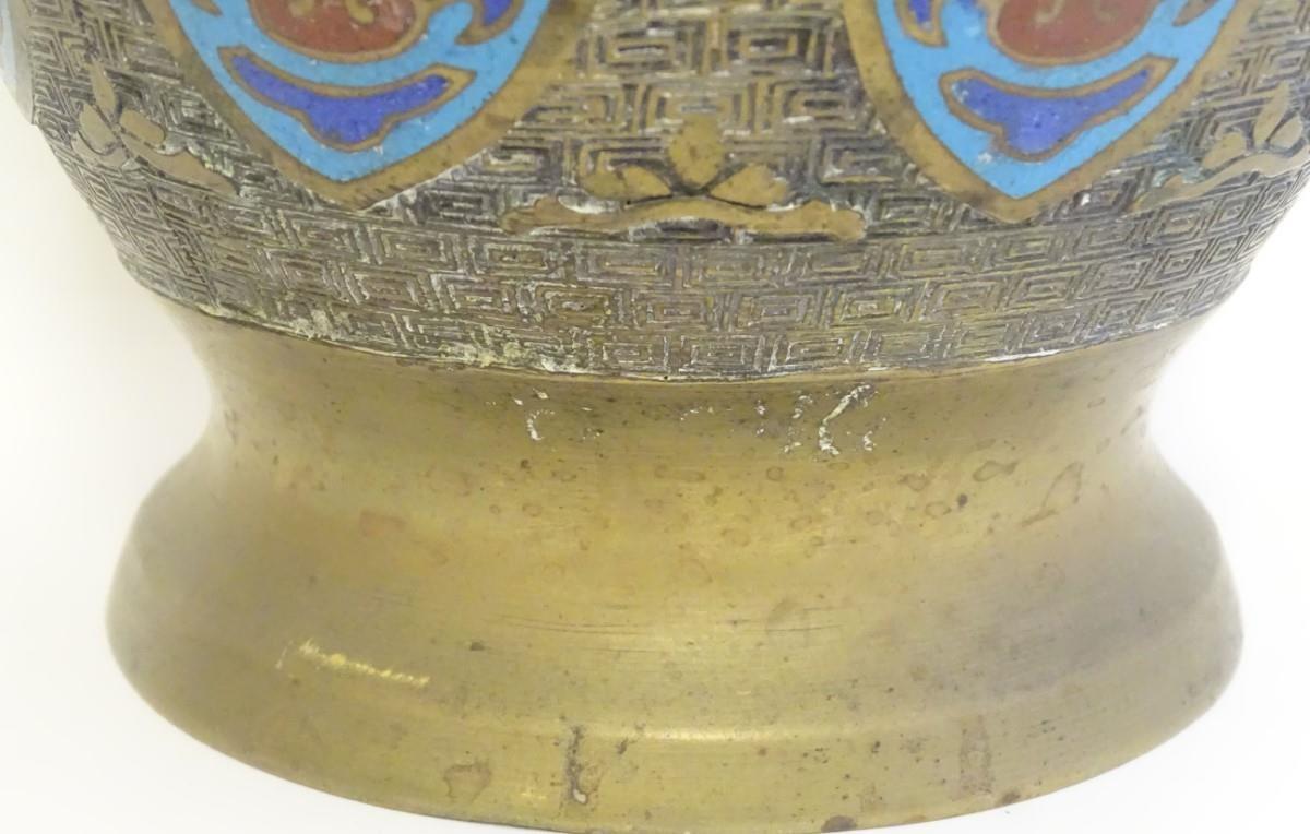 A Japanese brass vase of baluster form with Cloisonné mask and shield decoration to sides. Approx. 9 - Image 5 of 9