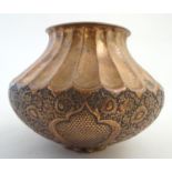 A late 19th / early 20thC copper pot / vase with hammed fluted decoration and embossed floral and