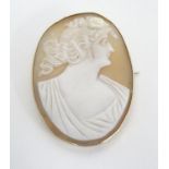 A 19thC shell carved cameo within a 9ct gold brooch setting. 1 3/4" long Please Note - we do not