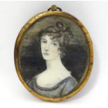 A 19thC oval watercolour portrait miniature depicting a woman. Approx. 3 1/2" x 2 3/4" Please Note -