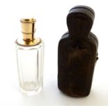 A 19th / 20thC Continental facet cut scent bottle with a 9ct gold top. Contained within a fitted