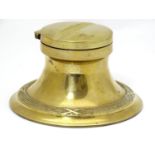 An early 20thC brass inkwell / standish with banded decoration and a glass liner. Approx. 2 1/2"