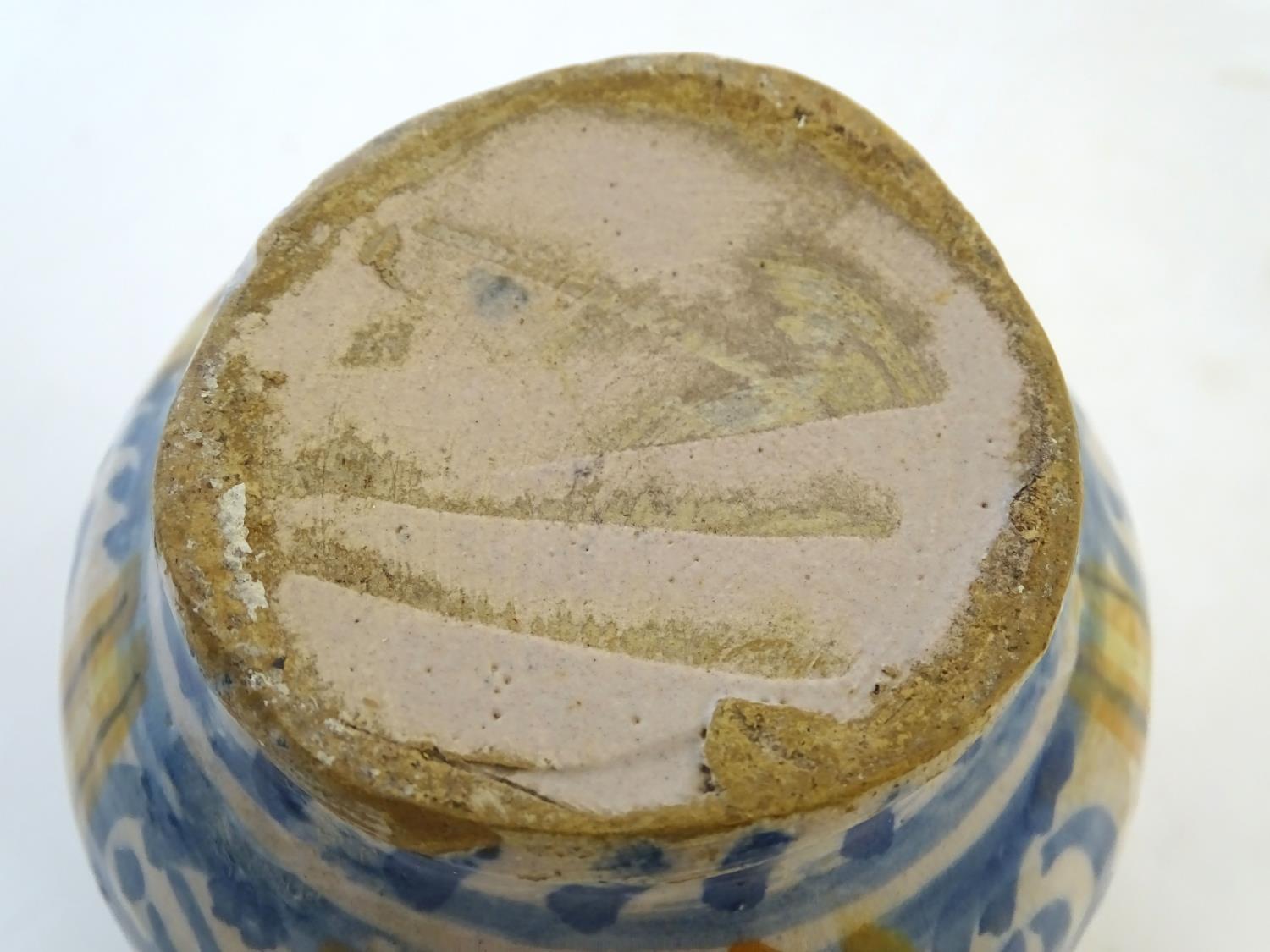 A 19thC Continental faience / tin glaze jug with a pinch spout, decorated with a roundel inscribed - Image 10 of 10