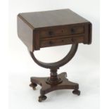 An early / mid 19thC mahogany sewing box / work box with a rectangular top flanked by drop flaps,