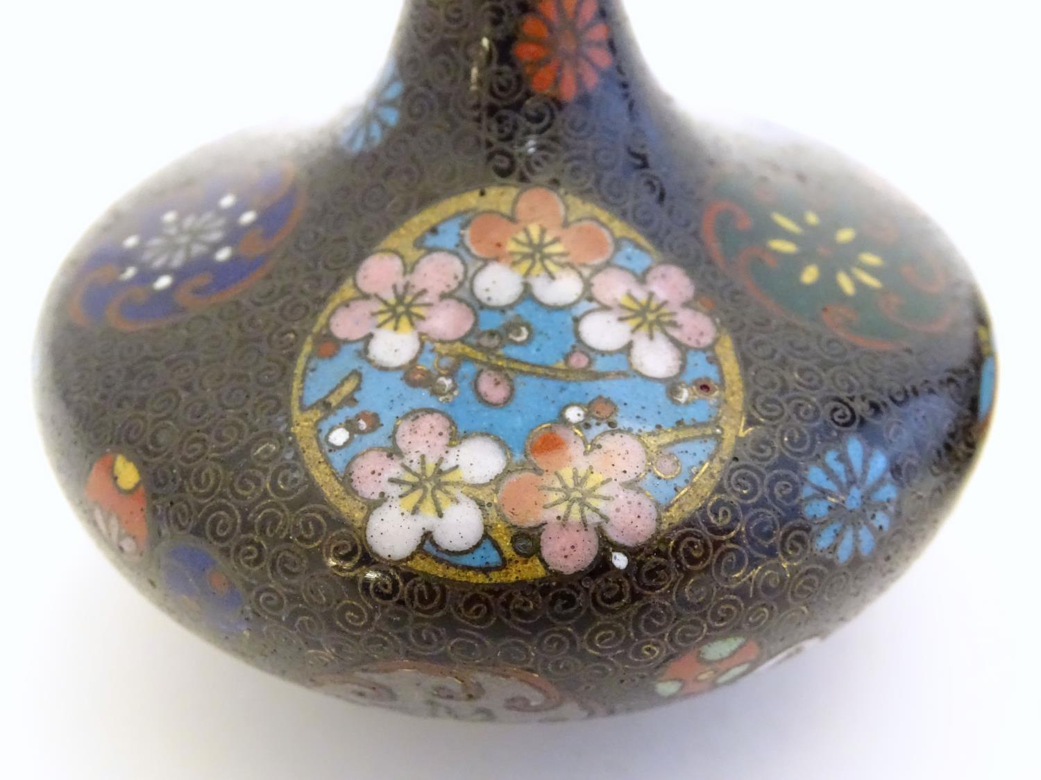 A pair of early 20thC cloisonne bottle vases with elongated necks and flared rims, with floral - Image 5 of 9